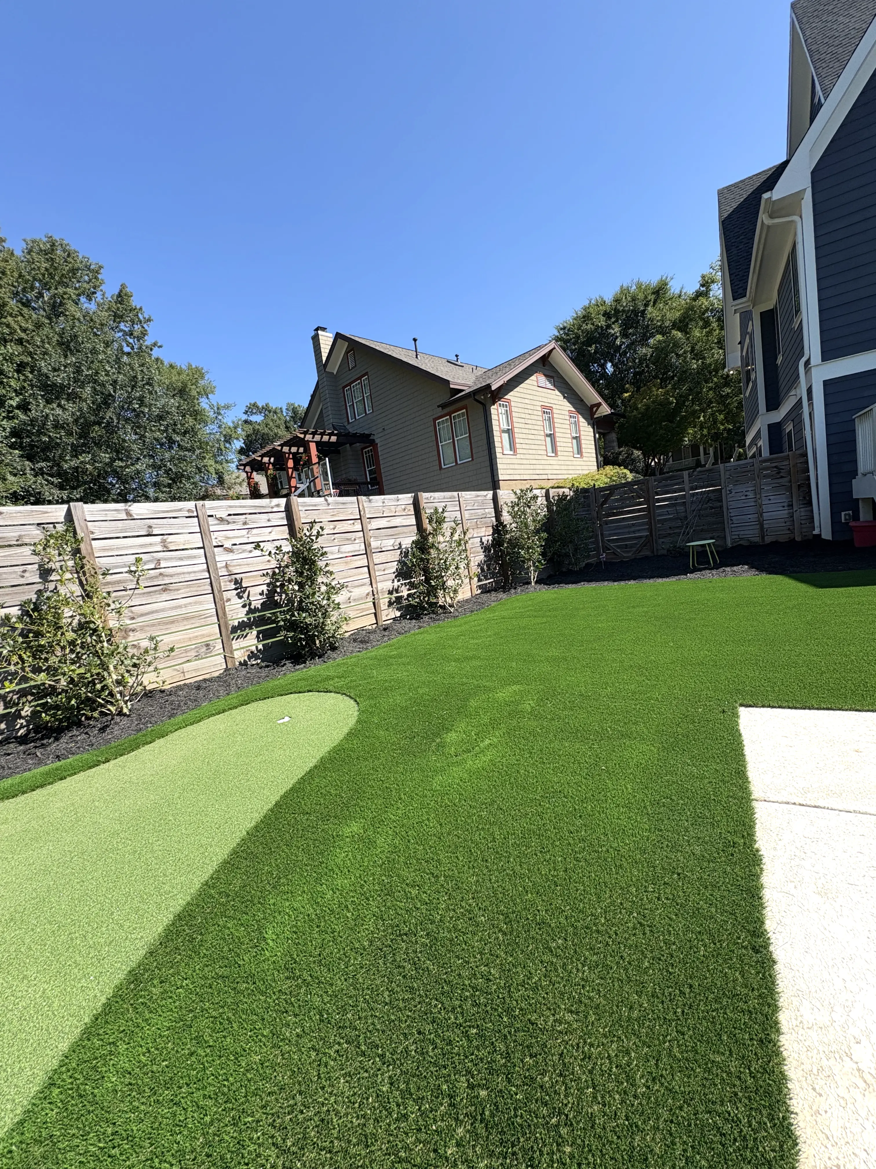 Putting Green & Backyard Lawn — Fenced Suburban